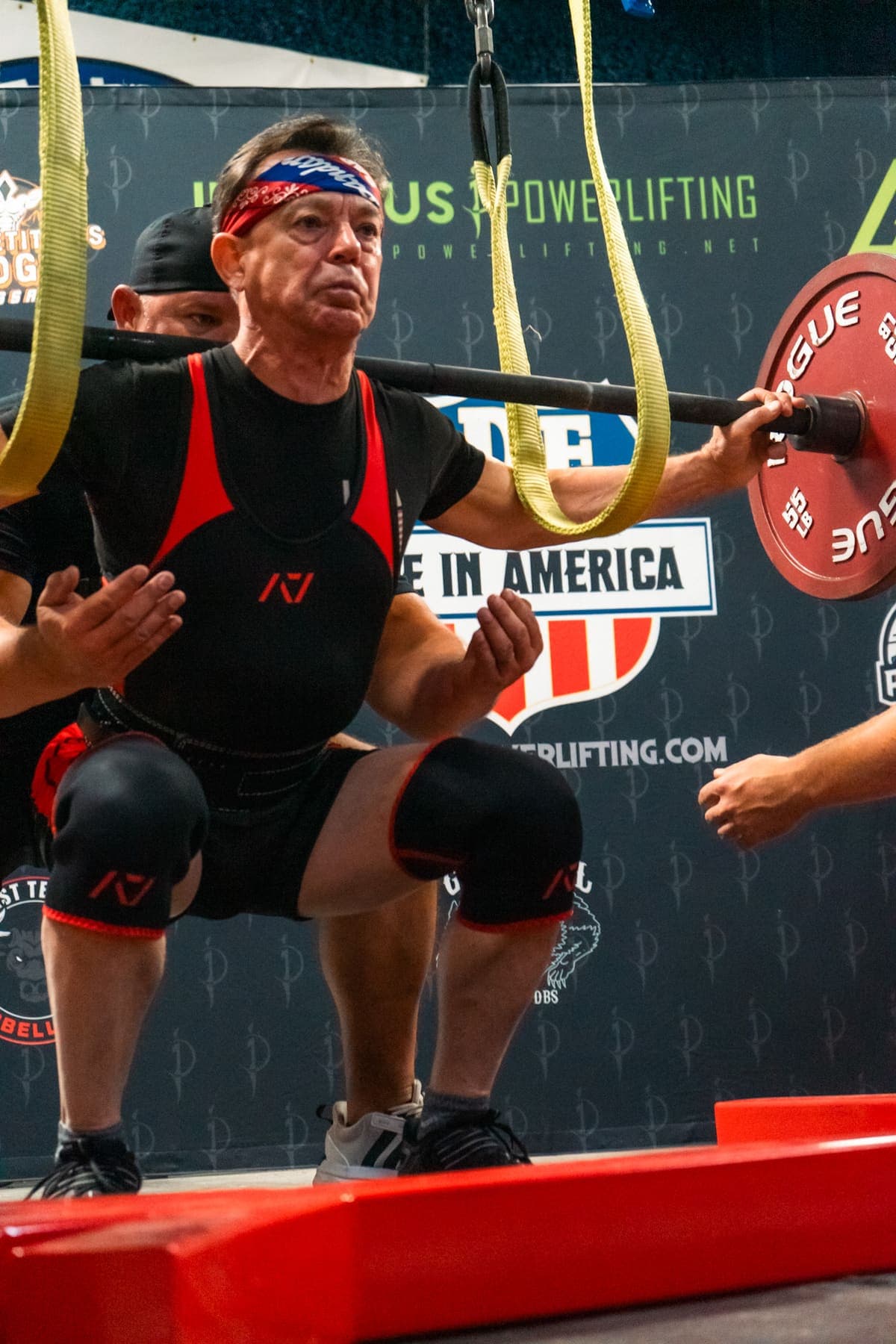 A training session being photographed on a gym floor
